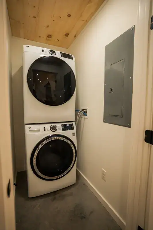 Stacked washer and dryer in the laundry alcove