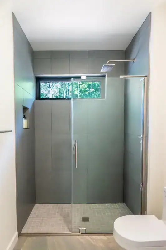 Glass shower and high bathroom window