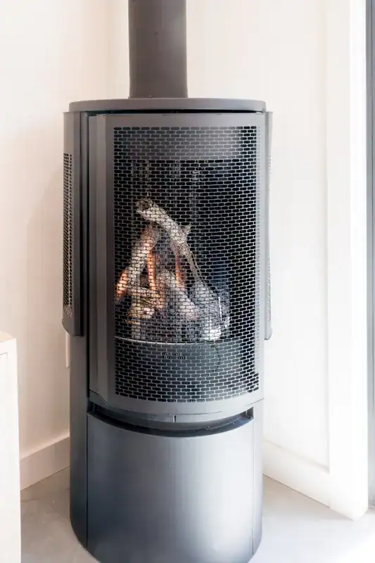 Stove beside the living room glass doors