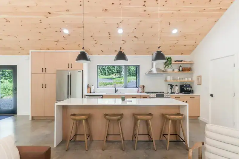 Kitchen island with stools and pendant lights