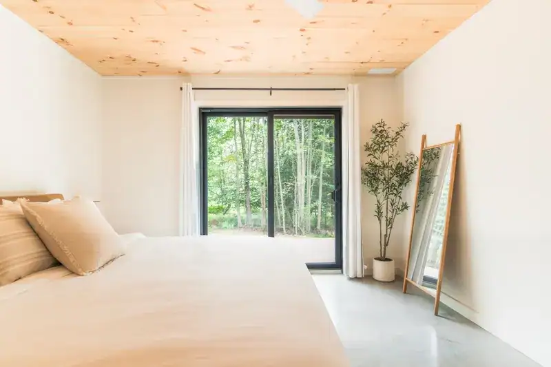 King bedroom and vaulted pine ceiling